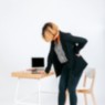 image of woman at work with back pain
