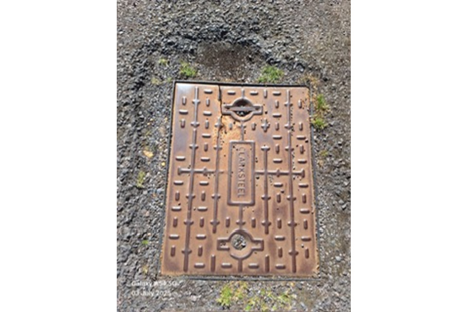 broken manhole cover