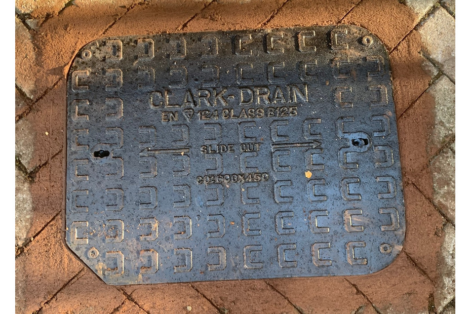 New manhole cover in driveway