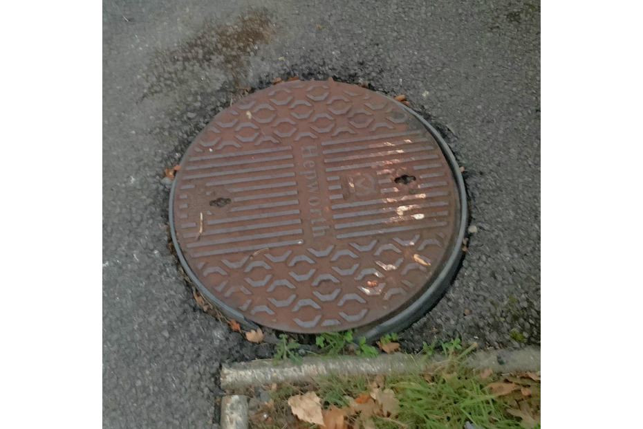 damaged manhole cover