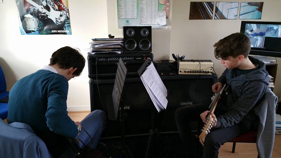 Two very keen guitarists... Guitar Lessons are taking over local music school