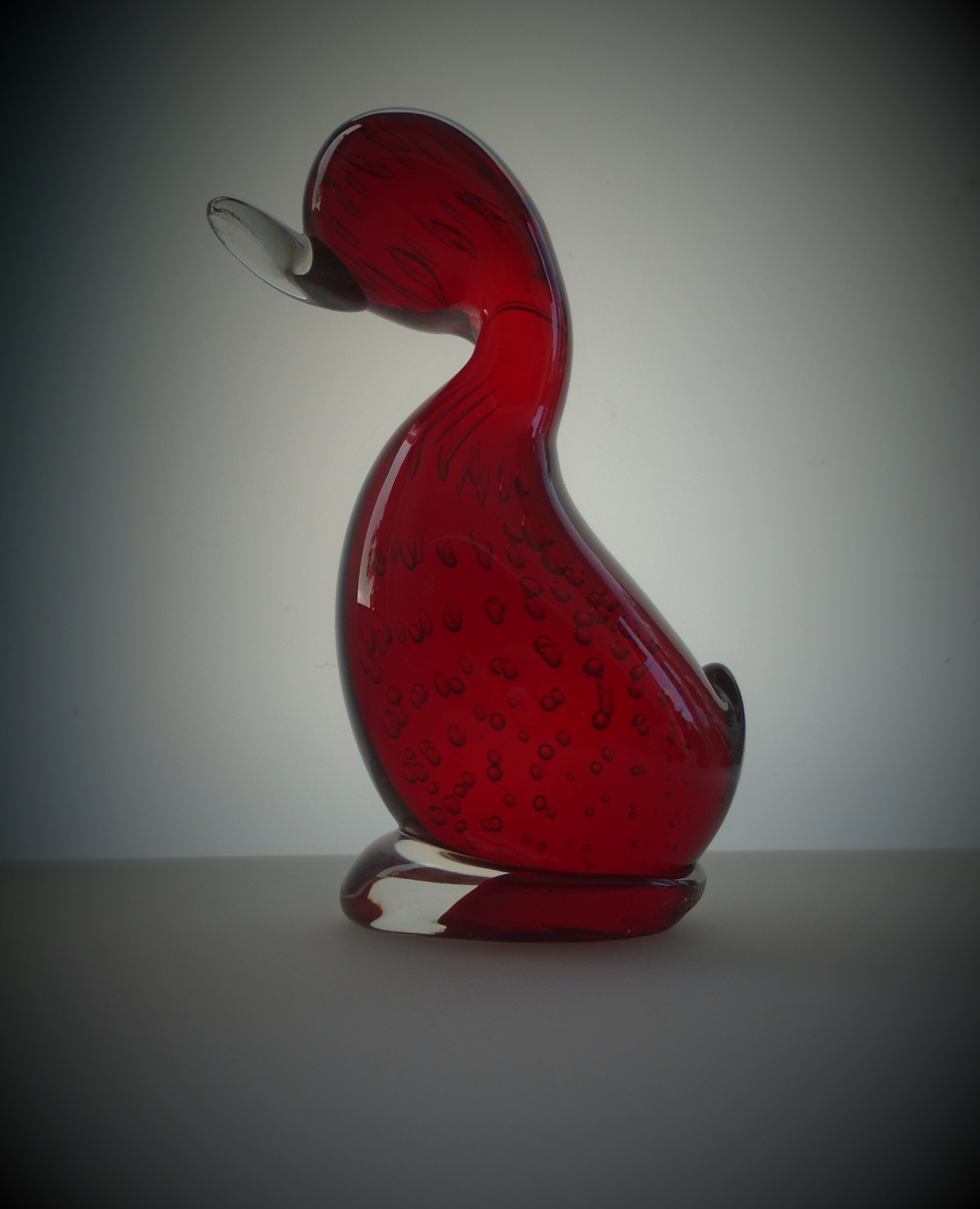 Offered for sale is a 14.5cms high WHITEFRIARS MID CENTURY RUBY GLASS DUCK with controlled bubble decoration