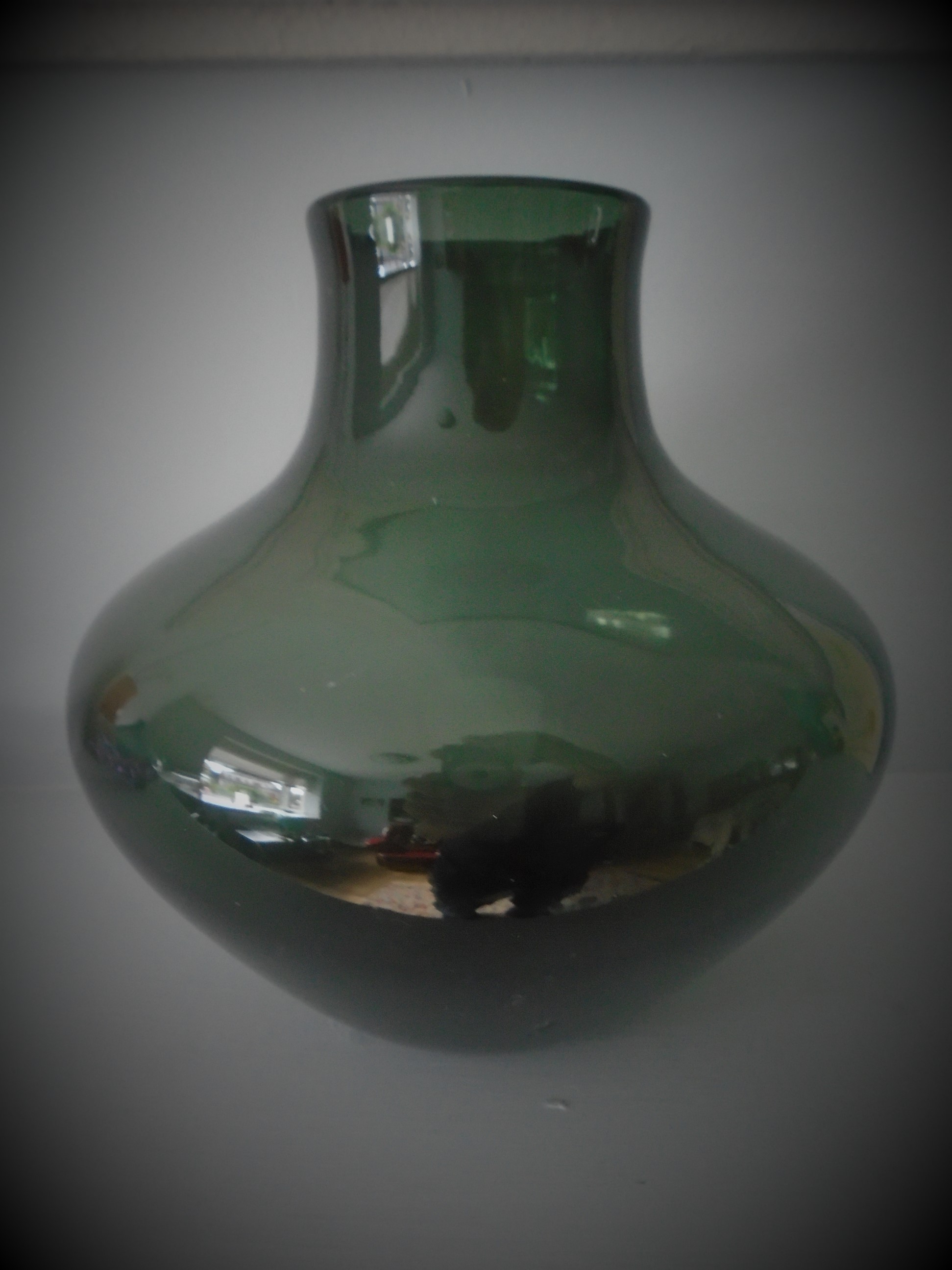 Offered for sale is what I believe to be a fine example of a GEOFFREY BAXTER WHITEFRIARS SODA GLASS VASE CATALOGUE NO. 9599 IN SHADOW GREEN