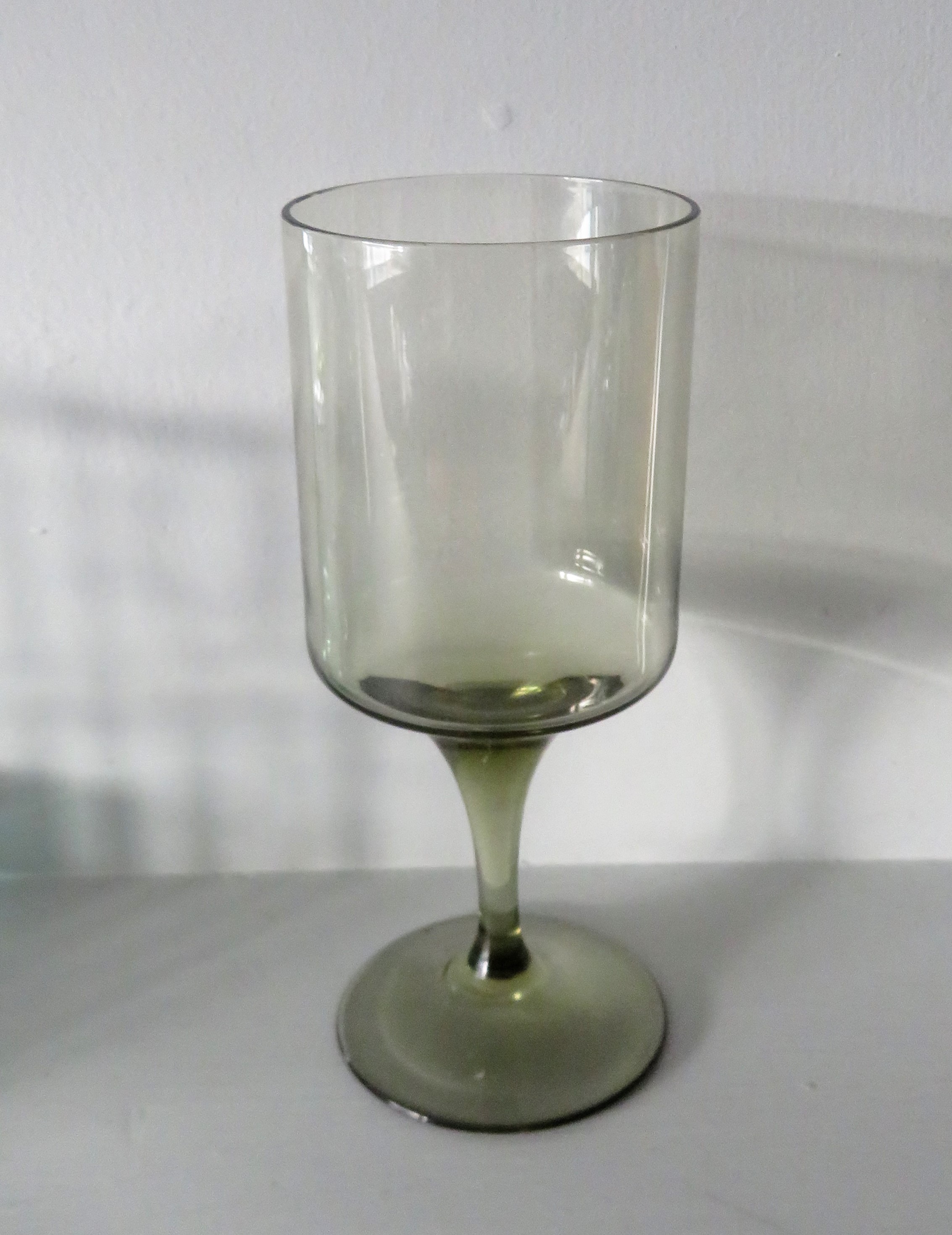 A Scandinavian style Wine Glass in smokey brown glass