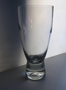 Scandinavian style stemless wine glass with solid indented base.