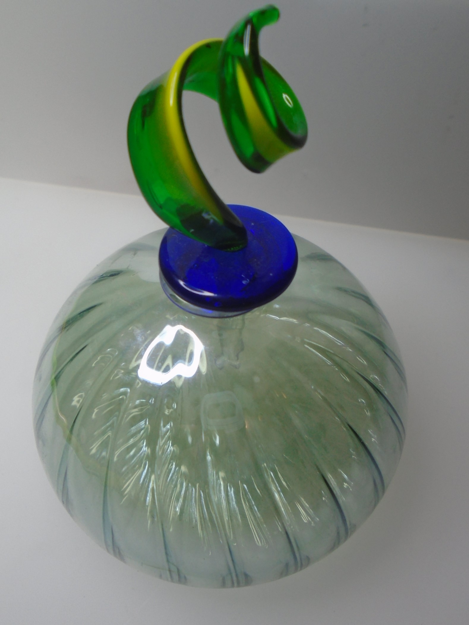 PRETTY GLASS PERFUME BOTTLE WITH SPIRAL SHAPED STOPPER.