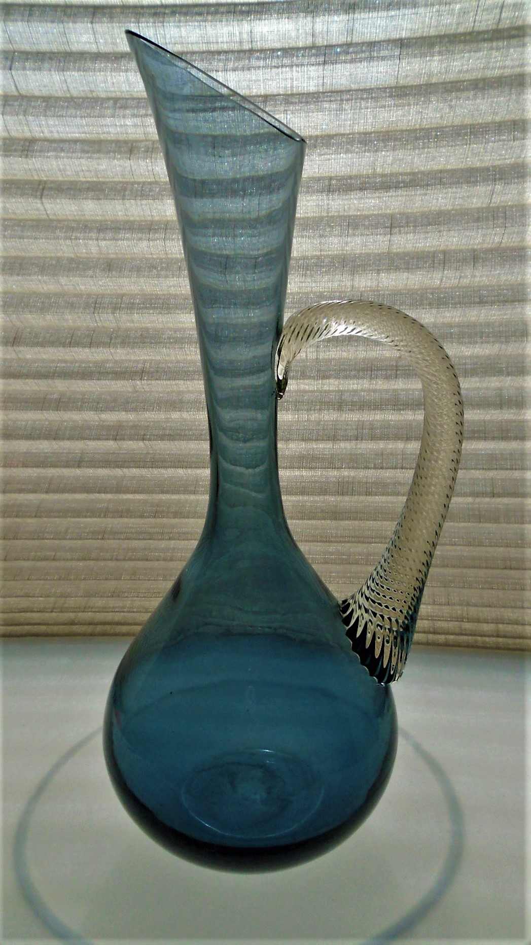 Beautifully elegant Mid Century Empoli Glass Water Pitcher in Indigo /Blue with twisted pattern clear glass handle