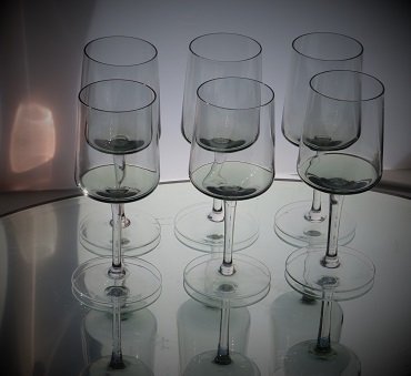 Set of 6 matching Scandinavian style wine glasses  in smoky grey glass  with  clear stems and base