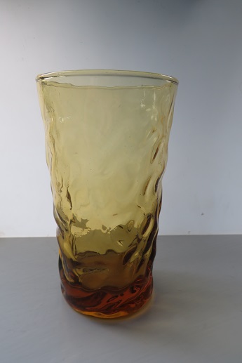 A pressed amber glass retro beaker