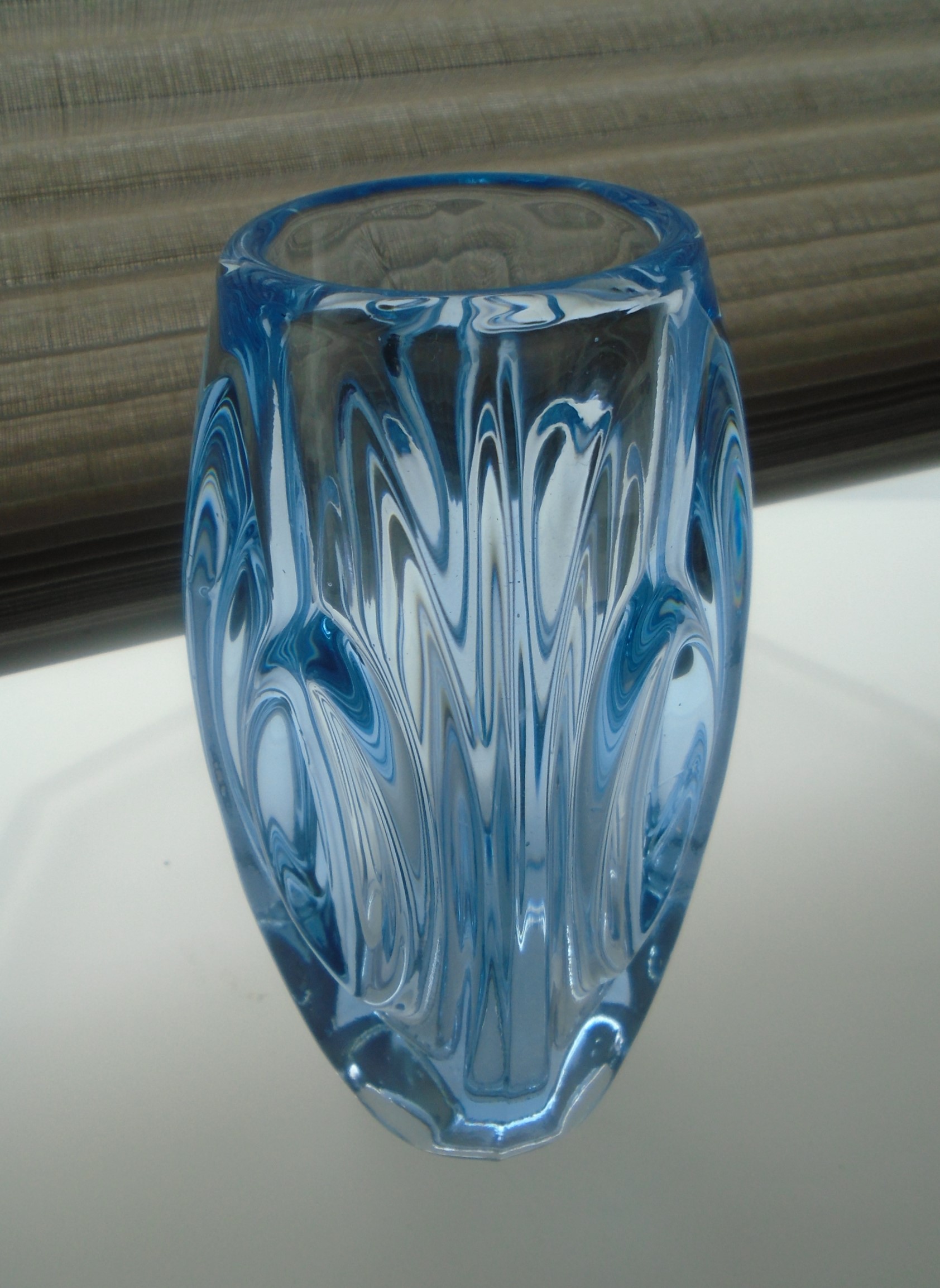 Offered for sale is a MID CENTURY SKLO UNION ROSICE GLASS 6"high  LIGHT BLUE LENS VASE  designed by R. SCHROTTER. 