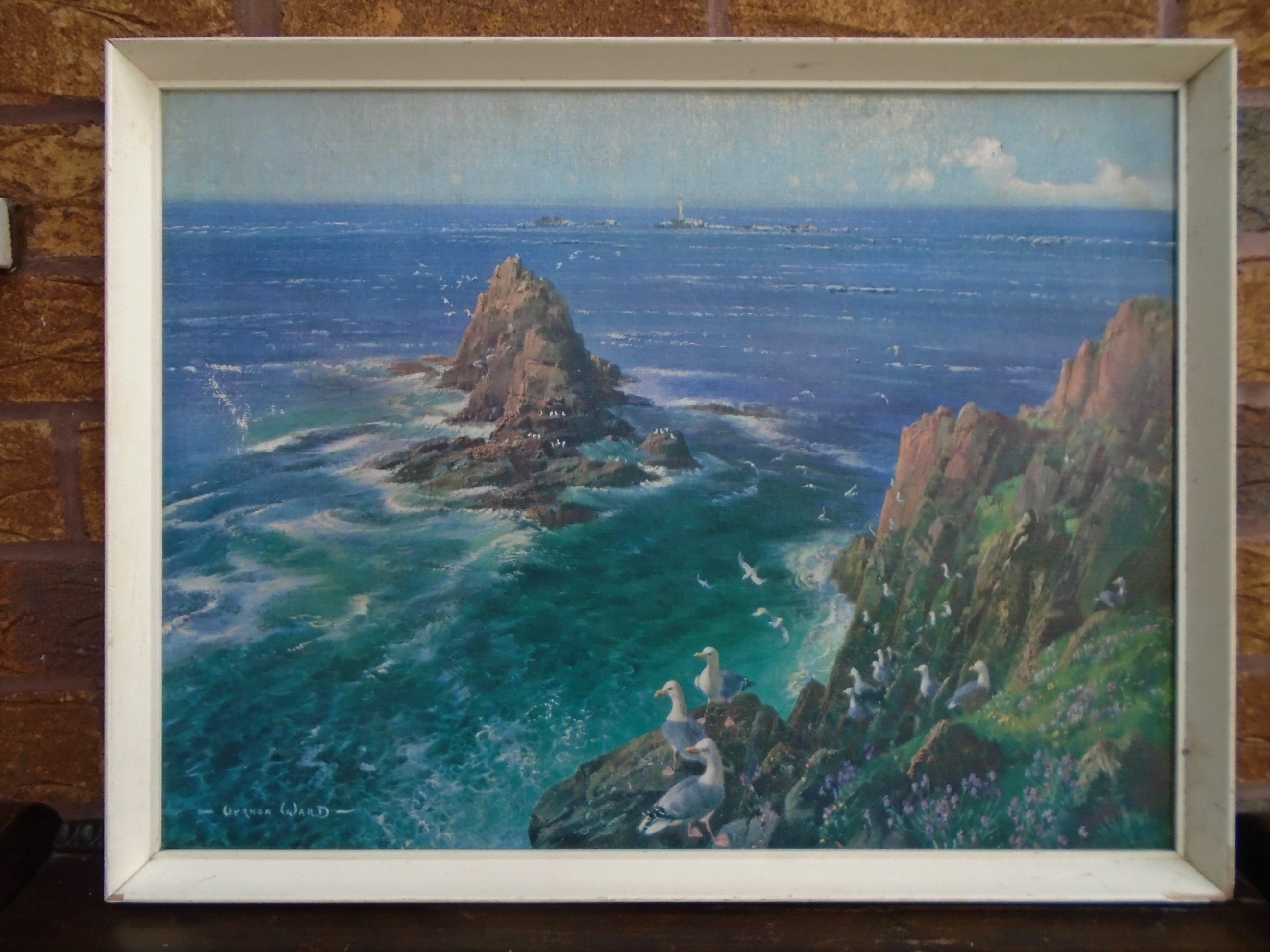 Offered for sale is a vintage framed (not glazed) textured  print of Armed Knight, Land's End, Cornwall' by Vernon Ward. 