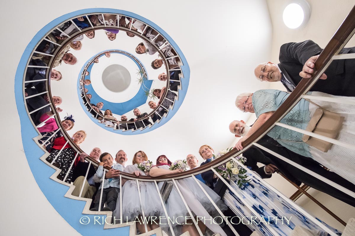 Wedding party on spiral staircase