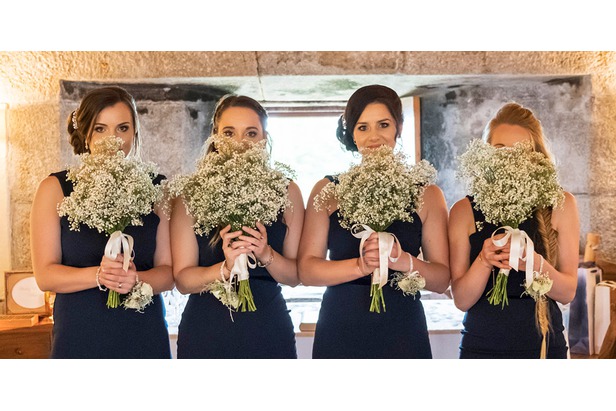 Bridesmaids holding flowers