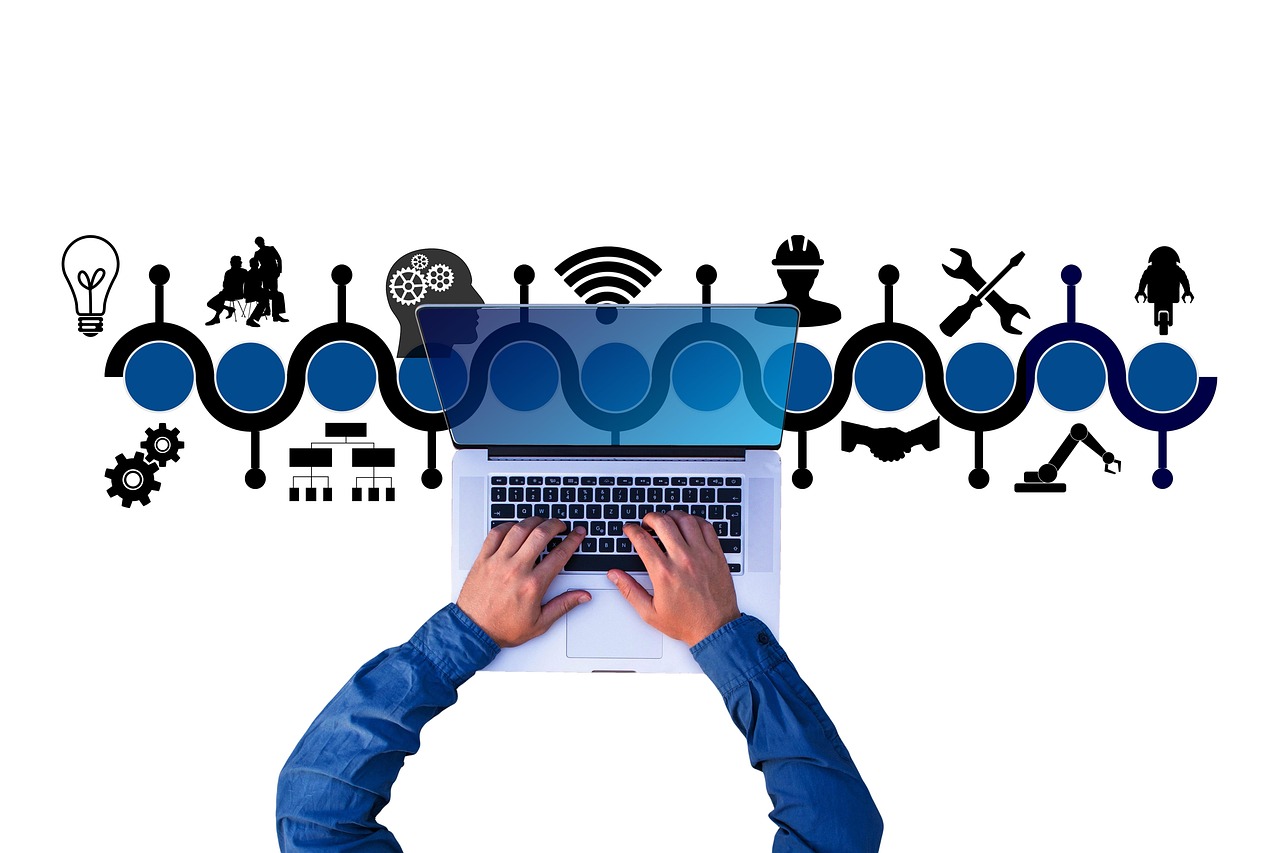 Laptop keyboard with images of project deliverable